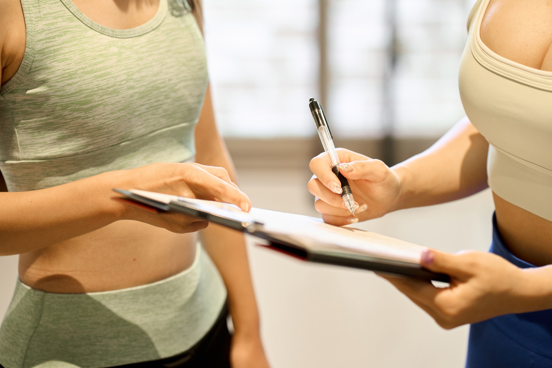 Female trainer giving counseling at the gym